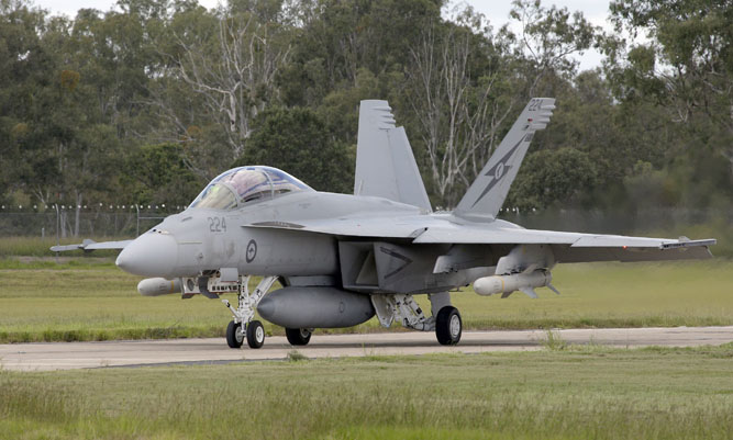 An RAAF Super Hornet taxis with live Harpoon ASuW missiles. (Defence)