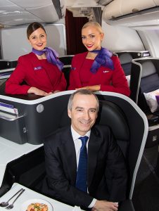 Virgin Australia chief executive John Borghetti models the new business class seats. (Seth Jaworski)