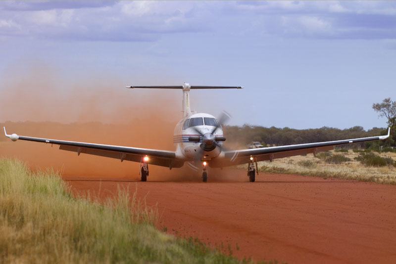 A file image of an RFDS aircraft taking off from an unpaved runway. (RFDS)