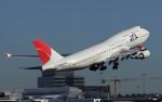 A JAL 747-400 takes off