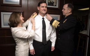 Vice Adm David J Venlet receives his shoulder boards during his promotion ceremony in February 2007 from his wife and then Chief of Naval Operations Adm Mike Mullen. 