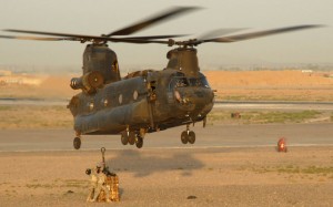 An Australian CH-47 Chinook helicopter prepares to take an underslung load of ordnance at Kandahar. (Dept of Defence)