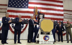 Congressman Ander Crenshaw (centre) helps unveil the new APG-63(v)3 AESA radar during a rollout ceremony at the 125th Fighter Wing in Jacksonville, Florida, on April 12. (ANG)
