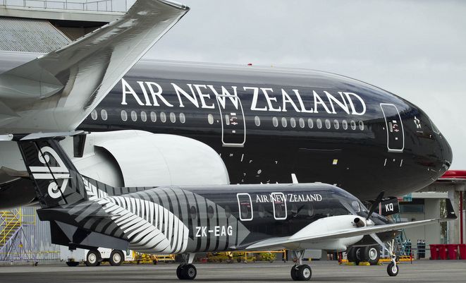 An Air NZ Link Beech 1900 next to a big brother 777-300ER.