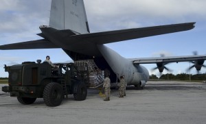 Crews unload a RAAF C-130J at the Marianas island of Rota. (Defence)