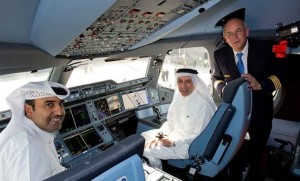 Qatar Airways CEO Akbar al Baker (centre) poses in the cockpit of A350 MSN3 in Doha. (Airbus)