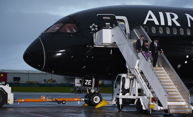 Air New Zealand chief financial officer Rob McDonald and some of NZ6789's crew disembark at Auckland.