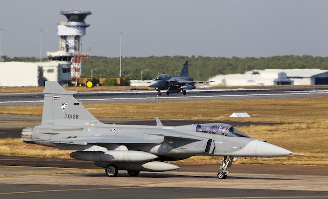 Two Royal Thailand Air Force JAS-39 Gripen aircraft taxi in after landing at RAAF Base Darwin.