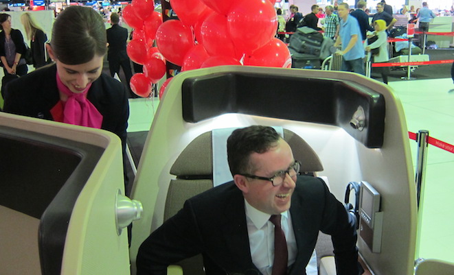 Qantas chief executive Alan Joyce tries out a mockup of the first class suite at Sydney Airport.