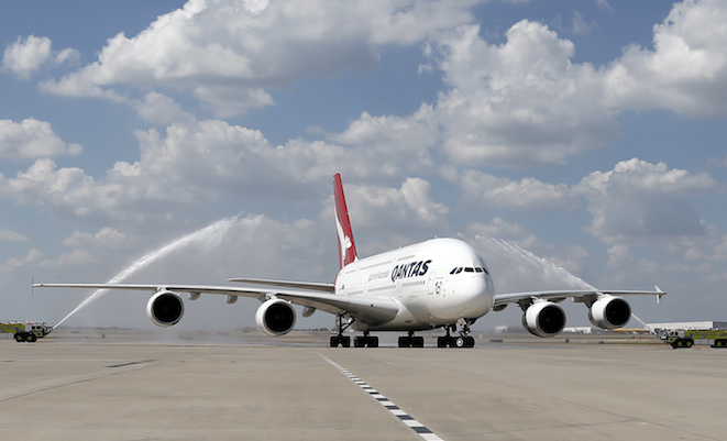 Qantas A380 VH-OQL operating QF7 get a water cannon salute at Dallas/Fort Worth Airport. (Qantas)