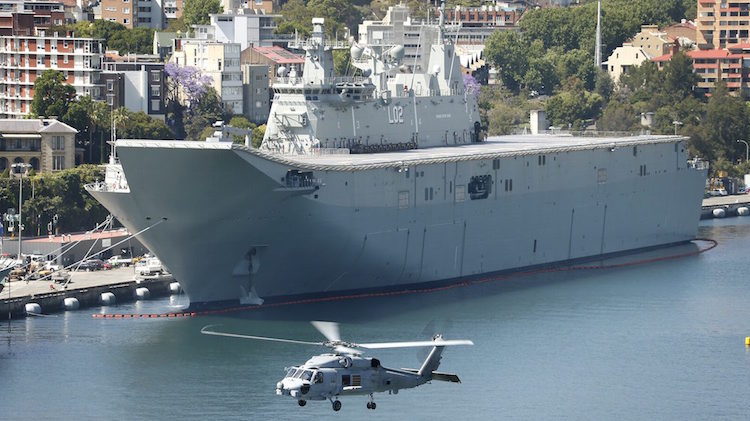 The first RAN MH-60R 'Romeo' Seahawk to fly in Australia flew over the now HMAS Canberra last month.