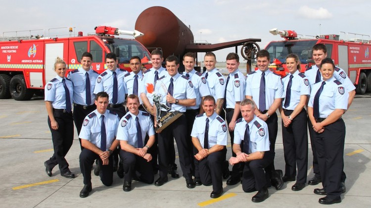 The graduating class from Airservices fire fighting course at Melbourne Airport in 2015. (Airservices)