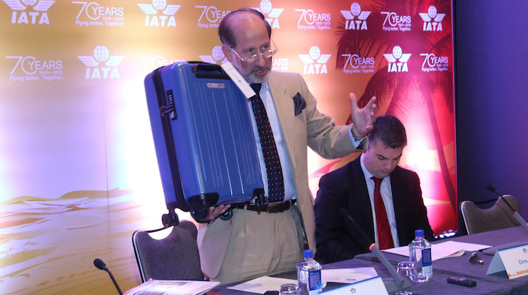 IATA senior vice president for airport, passenger, cargo and security Tom Windmuller with the new optimal size cabin bag. (IATA)