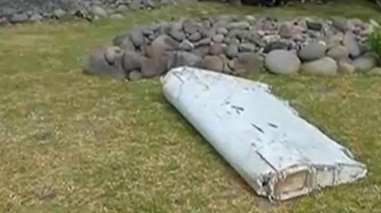 People conducting a cleanup of the beach at Reunion spotted what is believed to be part of an aircraft wing. (French Television Outre-Mer 1ERE)