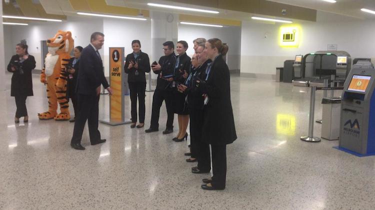 Tigerair Australia chief executive Rob Sharp with staff on the first day of operations at Melbourne Airport's new Terminal 4. (Tigerair Australia/Facebook)