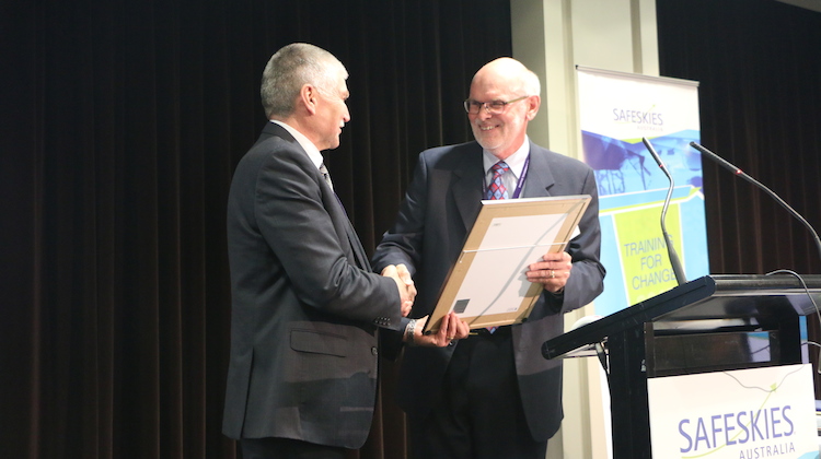 RAeS Australia division president John Vincent presents CASA director of aviation safety Mark Skidmore with his certificate of Fellowship of the Royal Aeronautical Society. (RAeS)