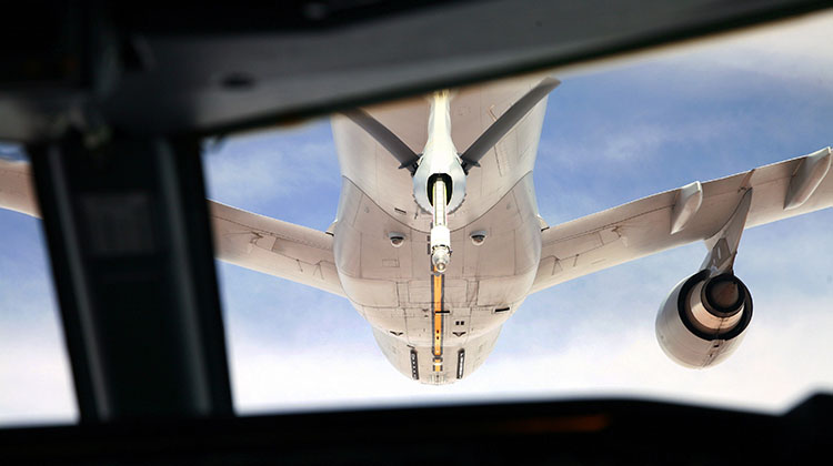 The view from the cockpit of a Royal Australian Air Force (RAAF) E-7A Wedgetail Airborne Early Warning and Control aircraft as it approaches a RAAF KC-30 Multirole Tanker Transport aircraft in the sky over northern Iraq. Clearly visible is the extended probe of the tanker’s refuelling boom, which features the latest technology available for this difficult operation. This rendezvous was a historic occasion, marking the first air-to-air refuelling of a RAAF aircraft in combat using the KC-30’s tail boom refuelling probe. The refuelling mission resulted in the flawless transfer of nearly 35,000 pounds of fuel from the tanker, allowing the E-7A to remain airborne for over 12 hours.