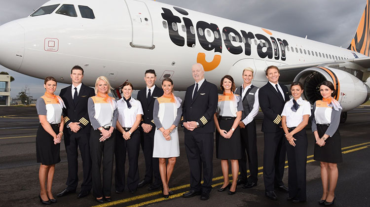 NEWS IMAGES FOR ONLINE AND EDITORIAL USE ONLY – NO SALES/NO ADVERTISING – please credit images by James Morgan if used or issued Melbourne Airport, Australia – Wednesday 21st October 2015............ New-look Tigerair Unveiled today- CEO Rob Sharp announces new uniforms, new aircraft and new customer innovations to make flying Tigerair better than ever at Melbourne Airport today. Pictured are the crew and CEO with the new aircraft which was revealed to media at the Tigerair base earlier this morning.