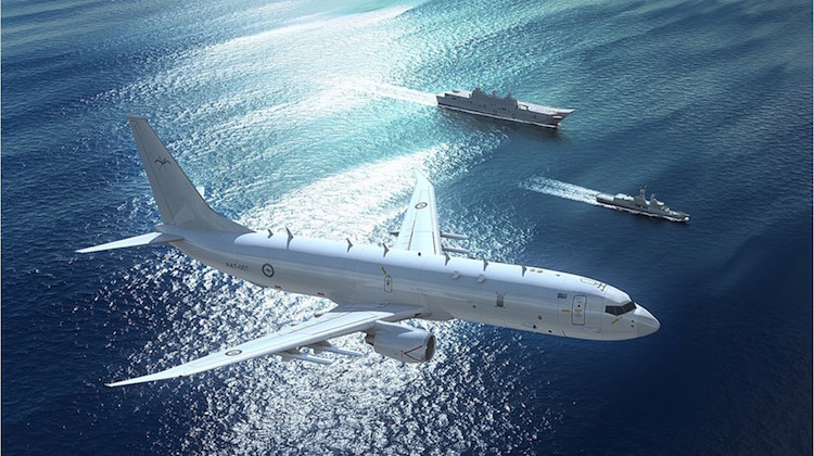 Boeing P-8A Poseidon promotional image with Royal Australian Air Force(RAAF) Markings (with LHD and ANZAC Frigate in rear)