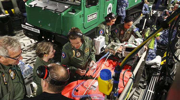 A No 3 Aero-Medical Evacuation Squadron team tend to a simulated patient during a training mission to Antarctica on board a C-17A Globemaster.