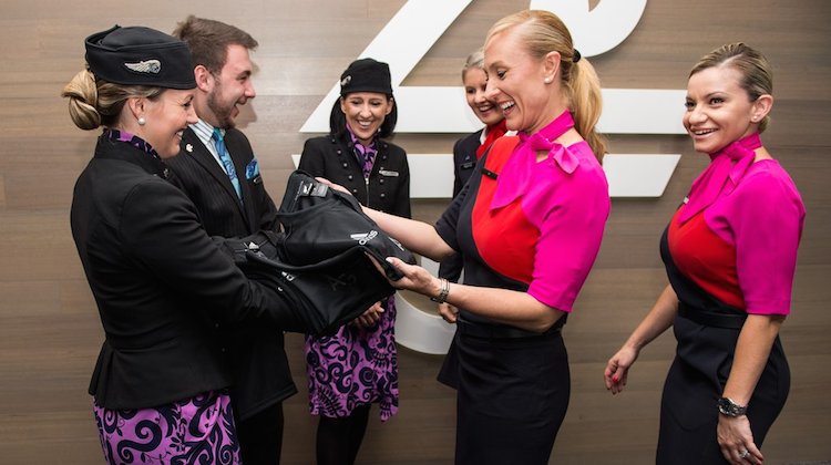 Qantas cabin crew get a look at a new uniform. (Qantas/Air NZ, Twitter) 