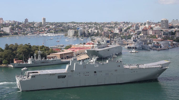 NUSHIP Adelaide rounds the northern most tip of Garden Island during her transit into Sydney Harbour. Her sister ship HMAS Canberra can be seen in the background.