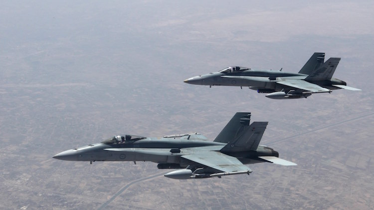 Strike Element F/A-18A's over the Taji Military complex on their transit home after a mission in northern Iraq. (Defence)