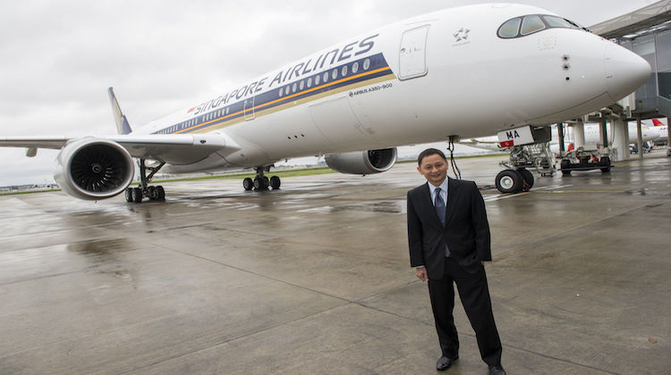 Singapore Airlines chief executive Goh Choon Phong stands in front of his airline's first A350-900, 9V-SMA, at the Airbus's headquarters in Toulouse. (Airbus) 