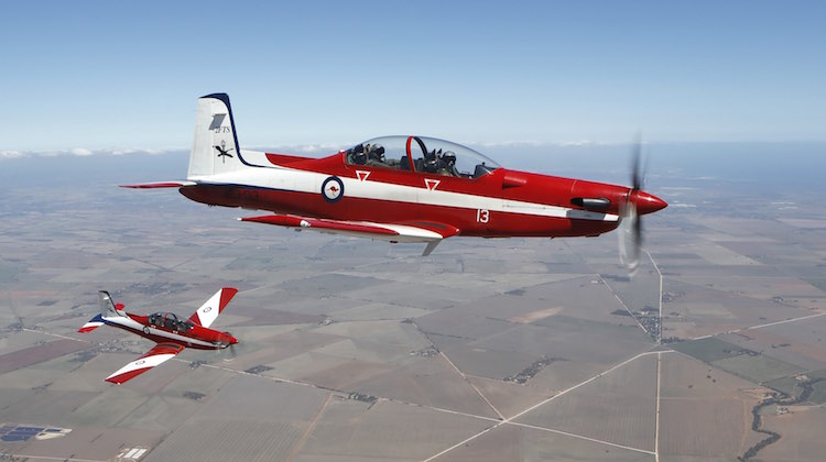 Air to air formation practice with a pair of PC-9 aircraft.