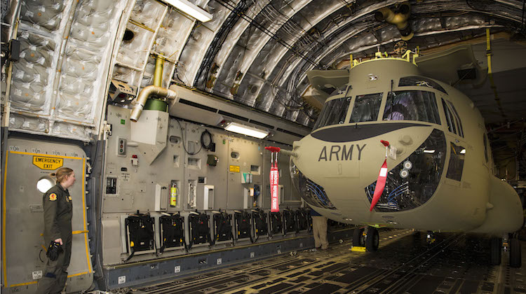 One of the three new Boeing CH-47F Chinook helicopters arrives at RAAF Base Townsville on June 13 aboard a US Air Force C-17 Globemaster cargo aircraft. (Defence)