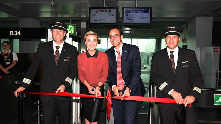 Celebrations at the gate lounge for Swiss's inaugural flight included a ribbon-cutting ceremony with Miss Switzerland 2013 Dominique Rinderknecht. (Swiss)