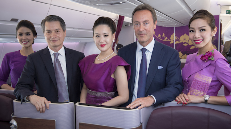 Thai Airways president Charamporn Jotikasthira and Airbus chief executive Fabrice Bregier pose on board of the airline's first A350. (Airbus) 