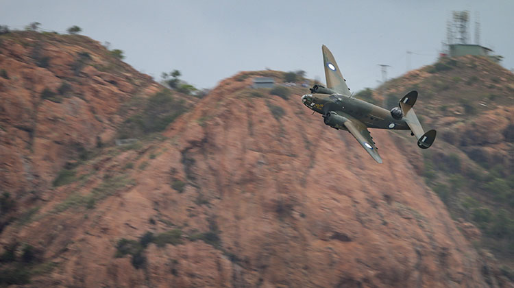 The historical Lockheed Hudson performs its flying display over the Strand foreshore, Townsville as part of the T150 Defence Force Air Show.