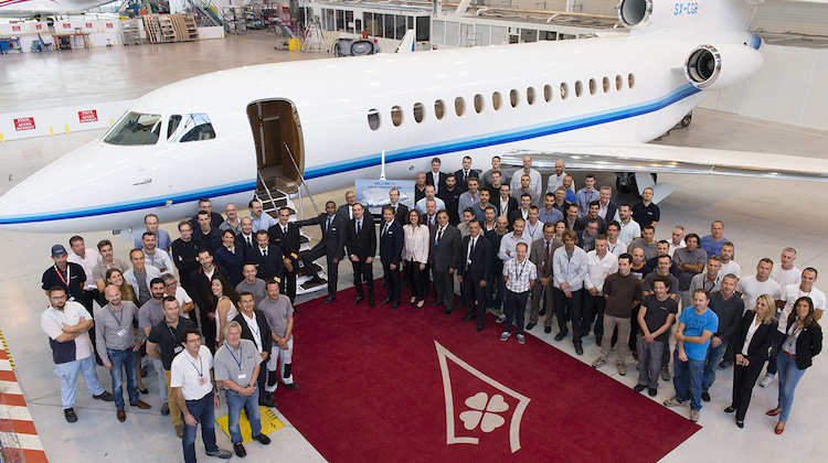 Dassault and Amjet staff celebrate the delivery of the Falcon 8X. (Dassault)