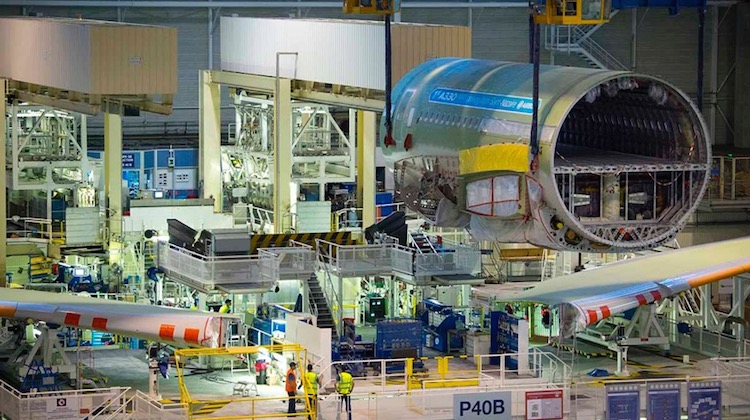 The wings are joined to the fuselage during final assembly of the first A330neo. (Airbus)