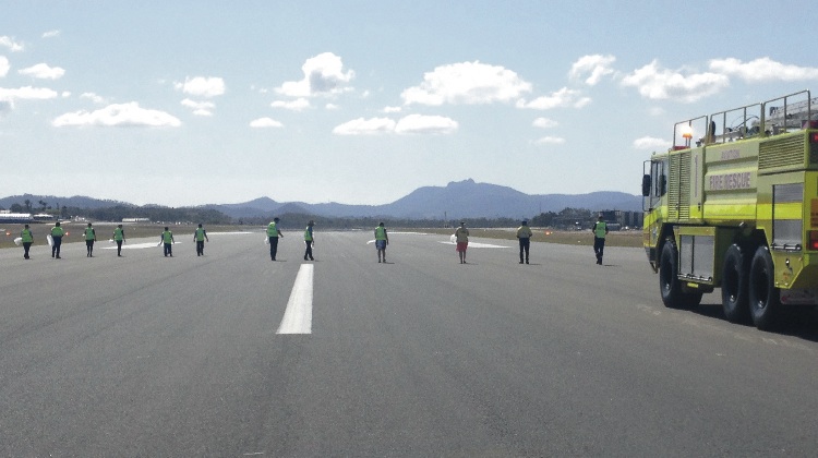 A file image of a foreign object debris (FOD) walk during a previous Airport Safety Week. (Airport Safety Week)