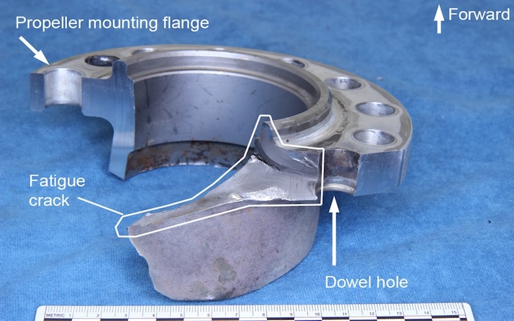 Section of the propeller shaft showing the fatigue crack originating at the dowel hole and progressing into the shaft itself. (ATSB)
