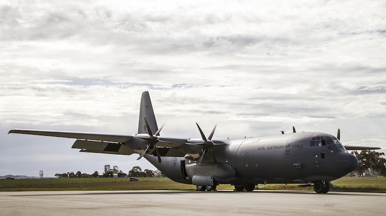 C-130J Hercules, A97-448, on the parking apron outside the Douglas Aerospace hangar at Wagga Airport following the aircraft's repaint. (Defence)