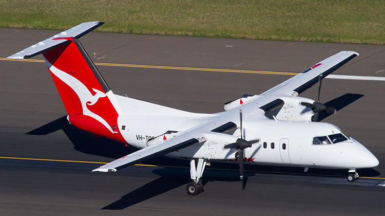A file image of a QantasLink Dash 8-200 at Sydney Airport. (Seth Jaworski)