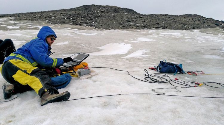 A geophysicist monitors a seismic test at the runway site. (Photo: Australian Antarctic Division/Andrew Garner)