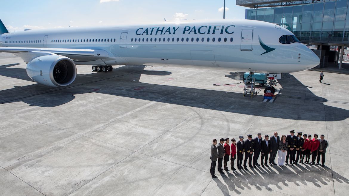 Cathay Pacific staff pose in from of the A350-1000. (Airbus)