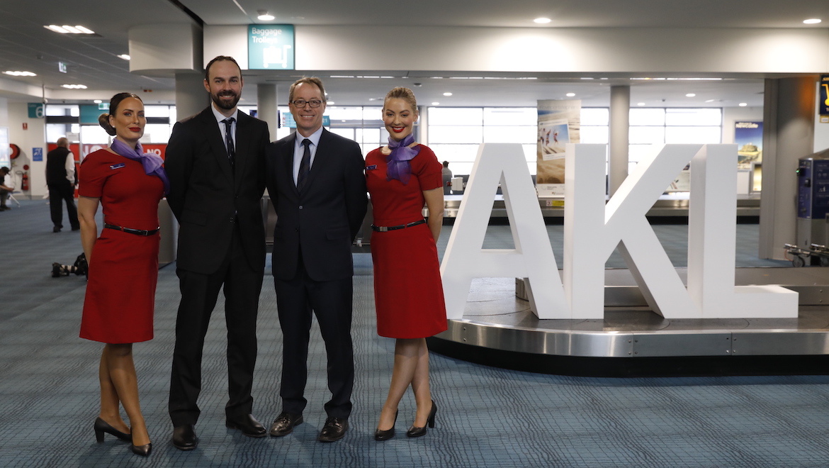 A file image of Virgin Australia's Russell Shaw and Newcastle Airport's Peter Cock with Virgin Australia cabin crew at Newcastle Airport. (Virgin Australia)