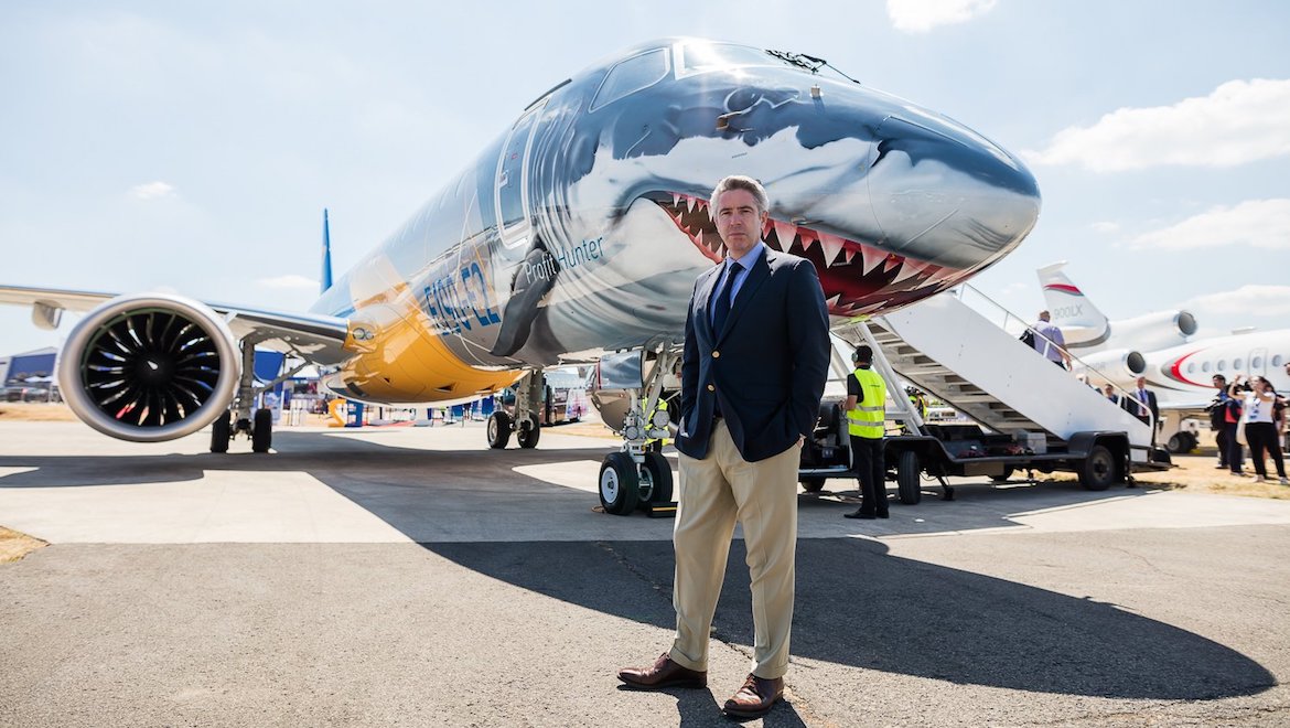 Embraer Commercial Aircraft chief executive John Slattery in front of the E190-E2. (Embraer/Twitter)