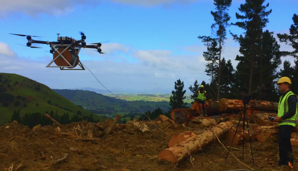 Lifting logs by drone in a Northland forest. (Andy Grant)