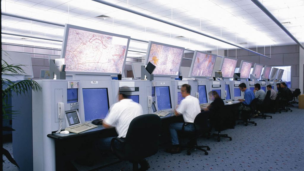 Air Traffic Controllers sitting at the work stations. (Airservices Australia)
