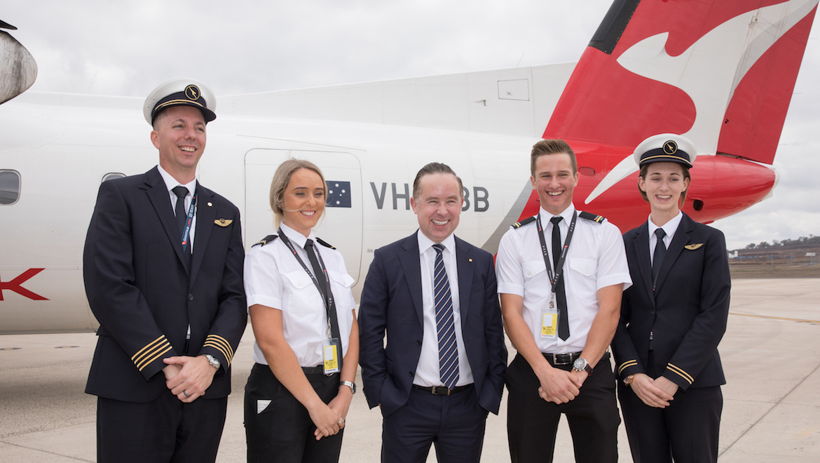 Qantas chief executive Alan Joyce with Qantas and student pilots at Wellcamp after announcing the airport as the venue for its pilot training academy in September 2018. (Qantas)