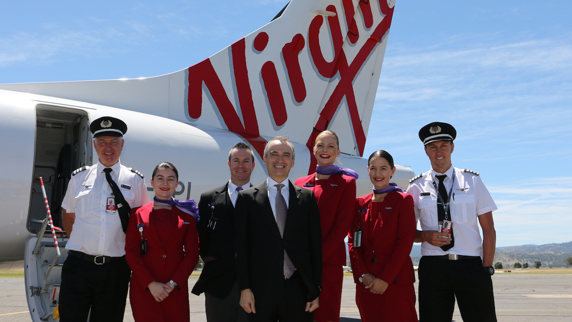 A 2015 file image of Virgin Australia chief executive John Borghetti with pilots and cabin crew at Tamworth Airport. (Virgin Australia)