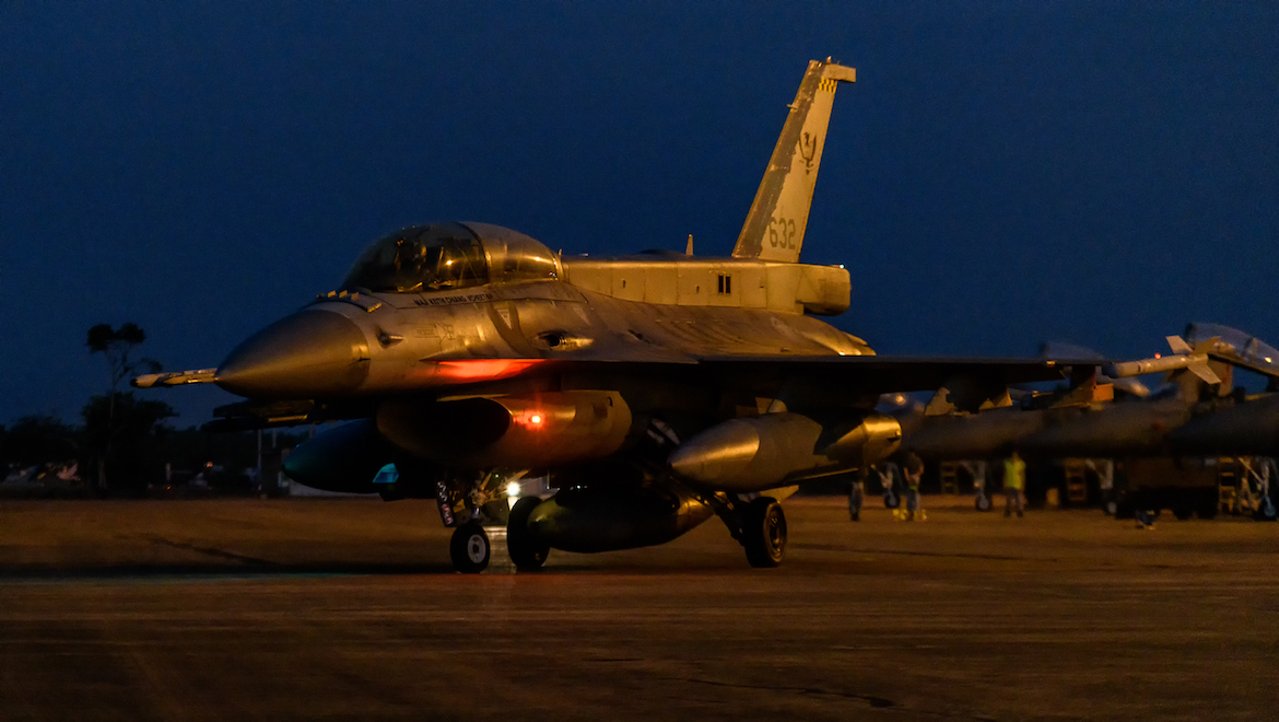A RSAF F-16D taxis out for a night-time mission. (Mark Jessop)