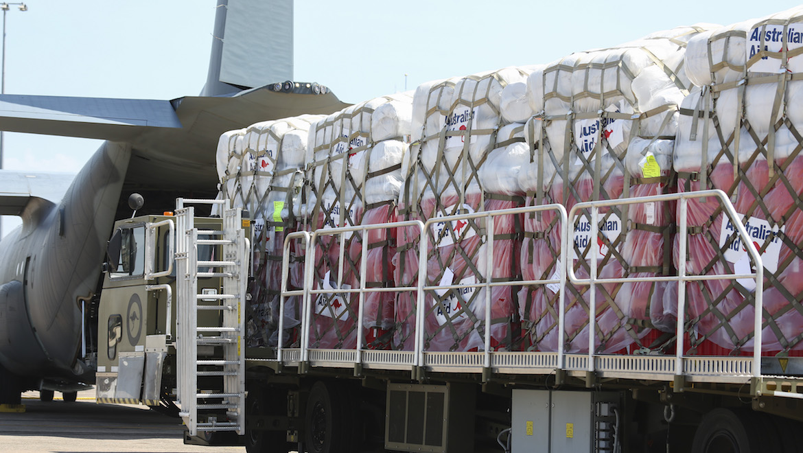 Humanitarian aid is loaded onto a Royal Australian Air Force C-130J Hercules at RAAF Base Darwin. (Defence)