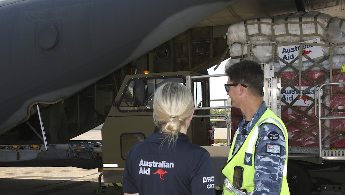 Department of Foreign Affairs and Trade Crisis Response Team and Royal Australian Air Force personnel supervise palettes of humanitarian aid being loaded onto a Royal Australian Air Force C-130J Hercules at RAAF Base Darwin, destined for Indonesia. (Defence)